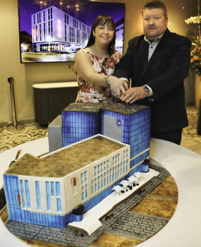 (L-R) Mary Middleton and James Conaghan cutting the cake at the VIP launch